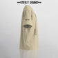 TAGGED25 STEELY SOUND - Beige Oversized Tee