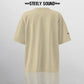 TAGGED25 STEELY SOUND - Beige Oversized Tee